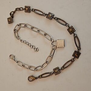 2 Bracelets, 1 is Silvertone & 1 is Bronzetone. Both are 6" w/ 1" Ext.